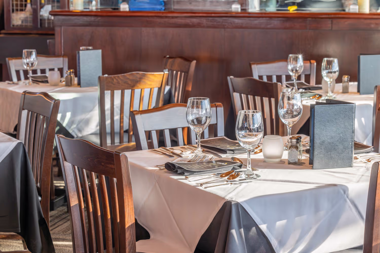 Main Dining Room with table settings and bay views
