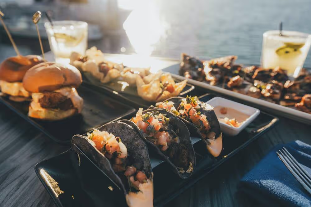 Happy hour dishes and cocktails at Boathouse on the Bay