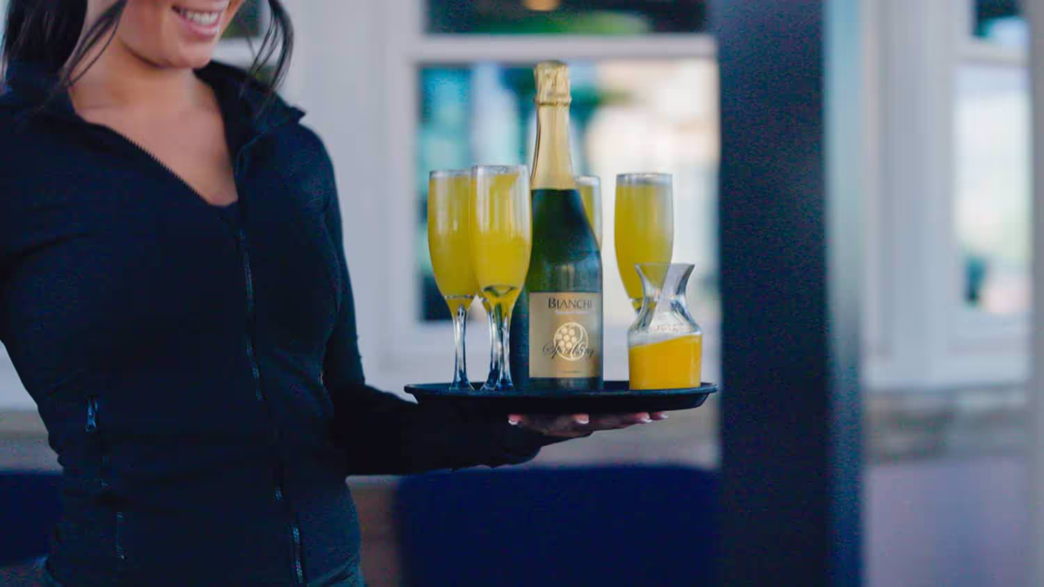 Colorful brunch mimosas served by the bay