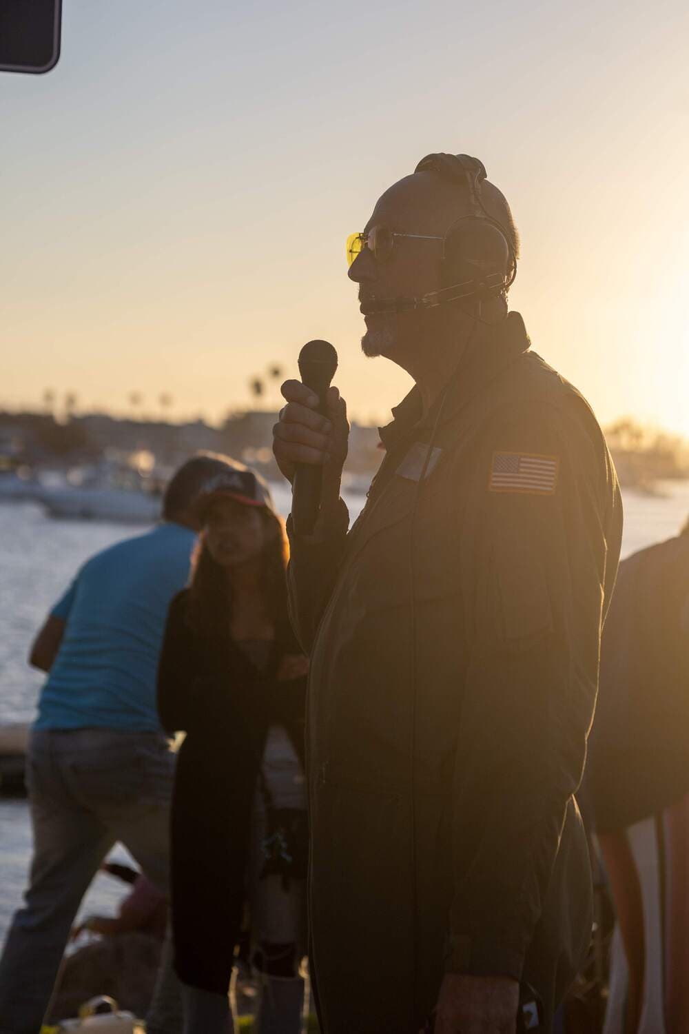 Two guests watch the fireworks finale from the waterfront