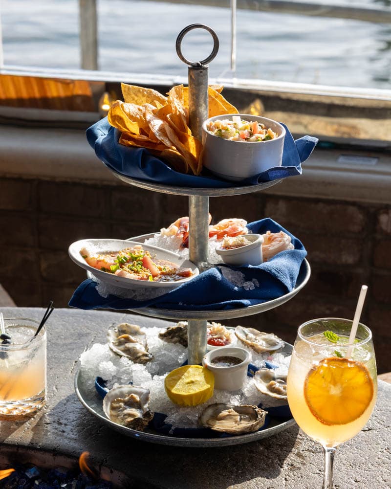 Iced Seafood Assortment at Boathouse on the Bay: oysters, shrimp cocktail, yellowtail crudo, and ceviche on a tiered tower
